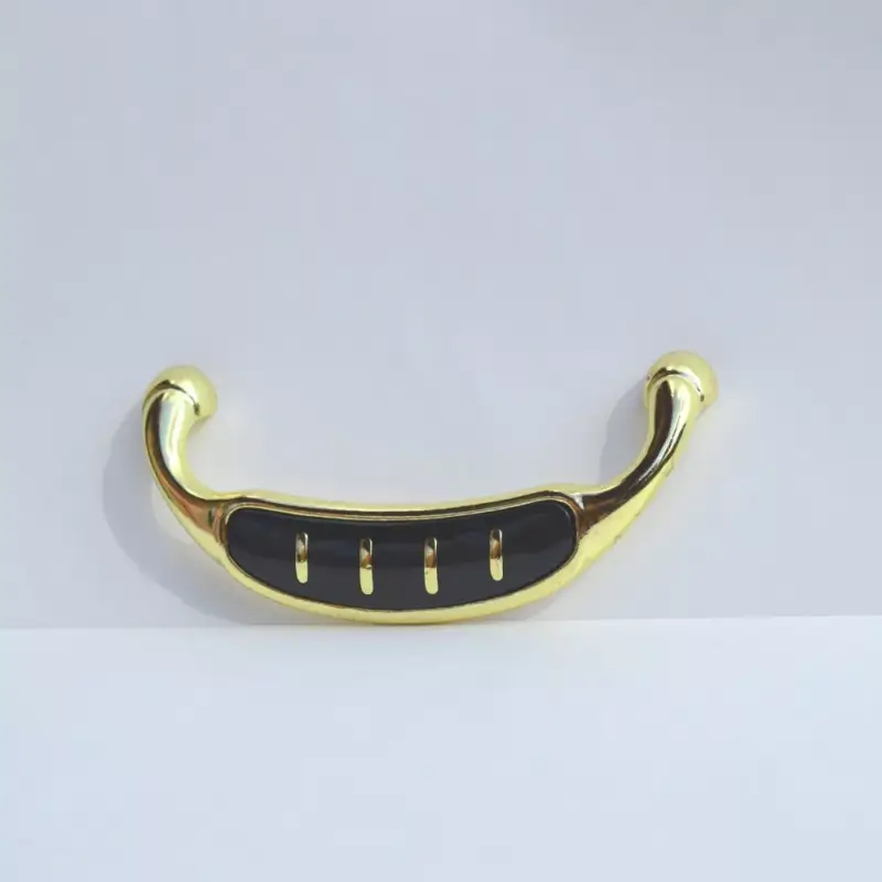 Vásárlói kedvenc Metall-Kunststoff-Möbelgriff, Farbe gold-schwarz, Bohrung 96 mm