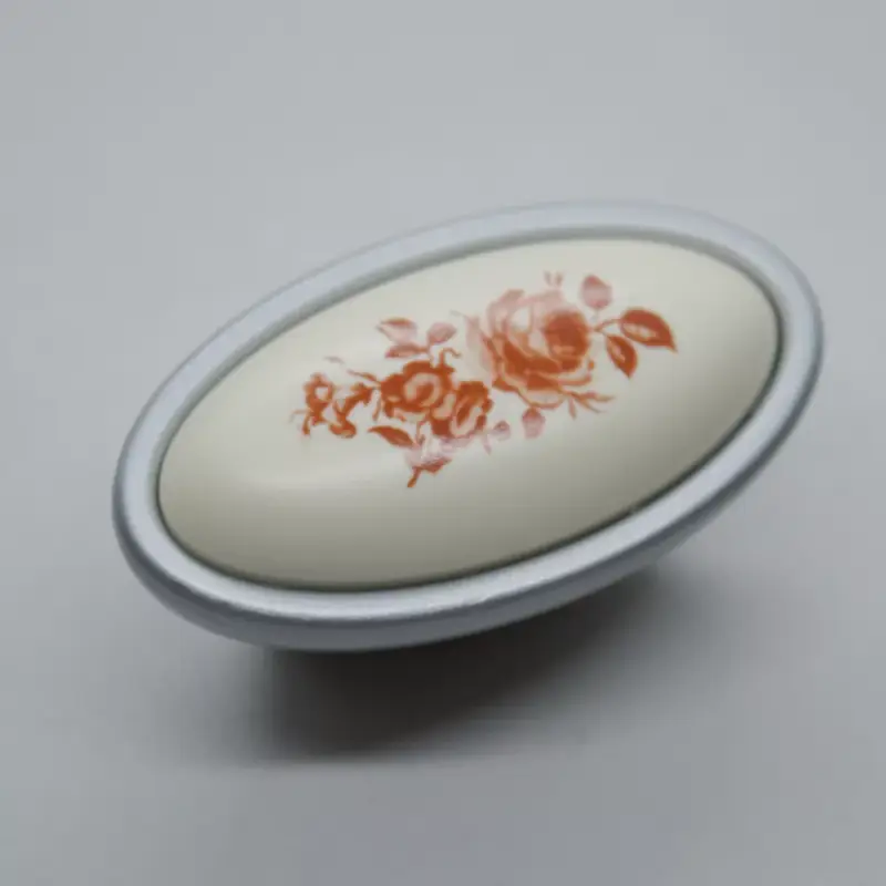Metall-Kunststoff-Möbelknopf in mattem Chrom mit Blumenmotiv Vásárlói kedvenc